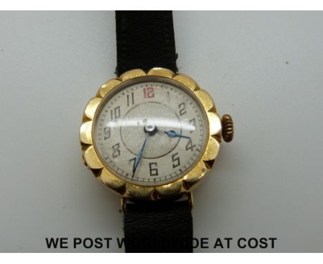 An 18ct gold watch with an enamel face
