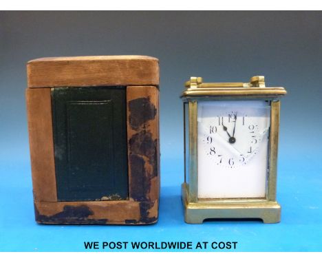 A French carriage clock with Arabic numerals, in carry case