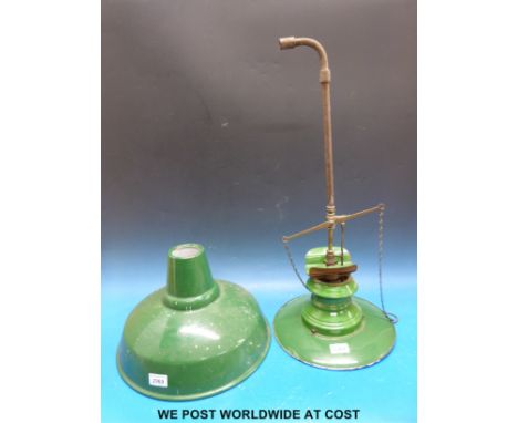 A green enamel gas lamp together with a similar shade