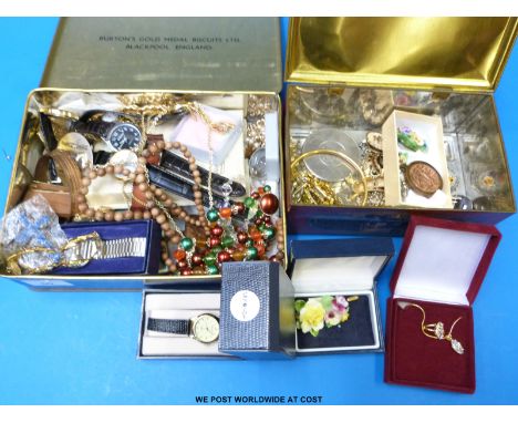 A quantity of costume jewellery to include faux pearls, watches, ceramic brooches etc