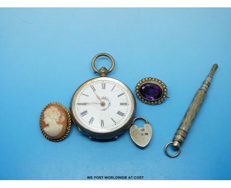 A white metal ladies fob watch marked 800, a silver brooch set with an amethyst, a cameo brooch, a propelling pencil etc 