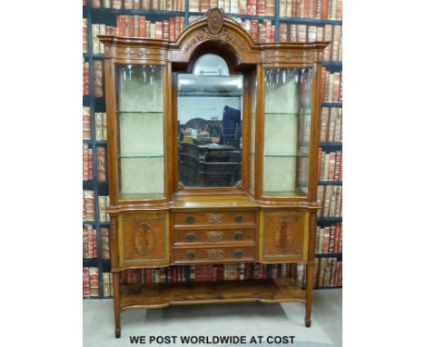 A fine late 19thC satinwood display cabinet, the top having central bevelled mirror flanked by serpentine fronted display cab