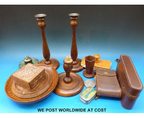 A collection of treen including turned oak candlesticks, pedestal bowl, vase, lighter, gentleman's dressing table set in leat