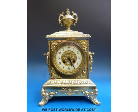 A Polish brass over wood cased French bracket clock with Japy Freres movement striking on a bell, the dial with pierced centr