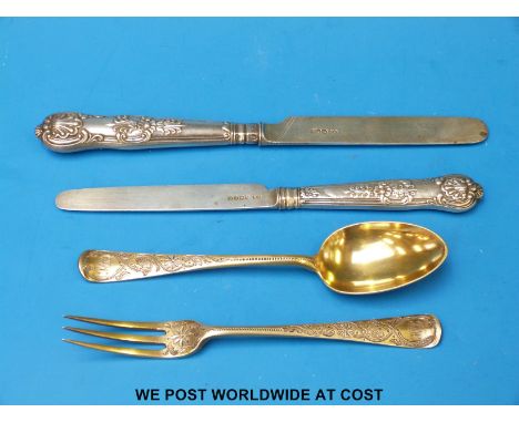 A Victorian hallmarked silver gilt Christening fork and spoon, (71g), together with two hallmarked silver-handled and bladed 