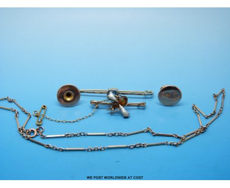 A yellow metal stick pin set with an aquamarine, a yellow metal brooch marked 9ct set with citrine and pearls in the form of 