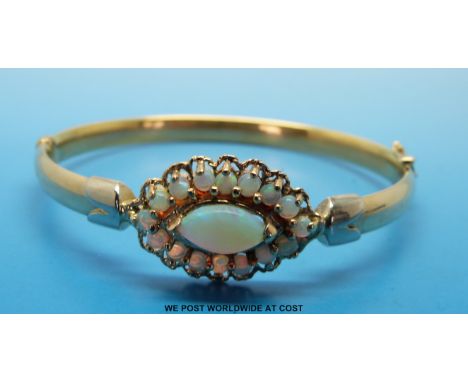 A 9ct gold bangle set with moonstone 