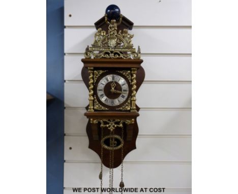 A reproduction Dutch clock with two-train movement, striking on a bell