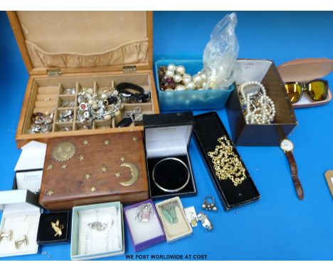 A hallmarked silver bangle, three white metal necklaces, silver cufflinks, two wooden boxes, necklace, brooches etc 