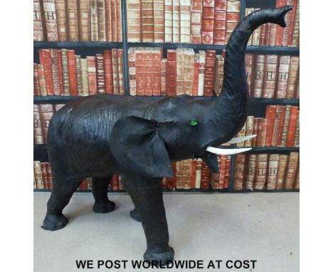 A possibly Liberty leather elephant footstool (Height to tip of trunk 106cm, L120cm)