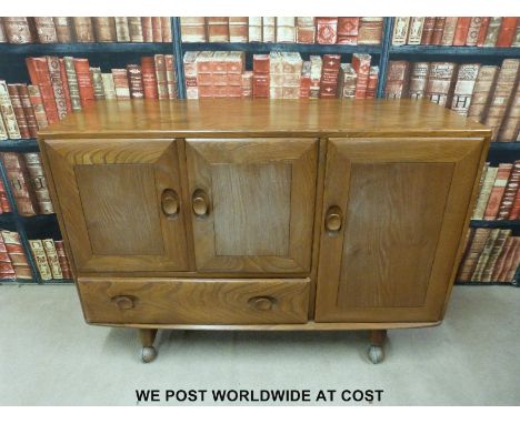 Ercol light elm retro sideboard with three doors and one drawer (H82 x W116 x D45cm)
