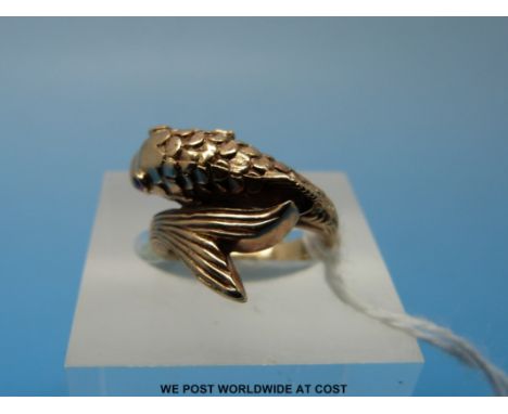 A yellow metal ring set in the form of a fish with ruby eyes (size D) 