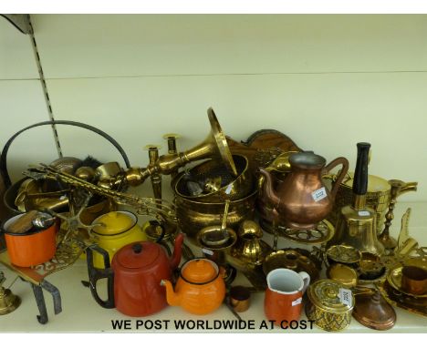 A large collection of brass and copper ware including jam pan, fire tools etc