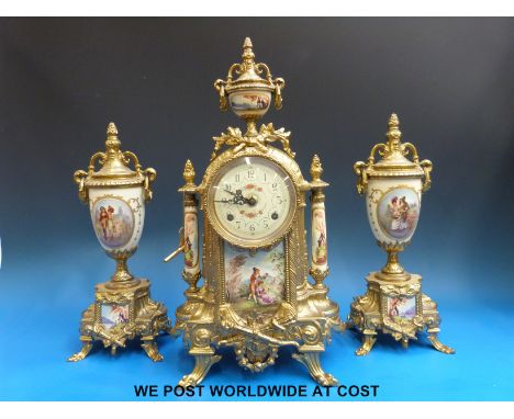 A French gilt metal and porcelain clock garniture