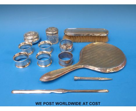 Six hallmarked silver napkin rings (111g), together with a Victorian hallmarked silver trinket box (60g), a silver-topped gla