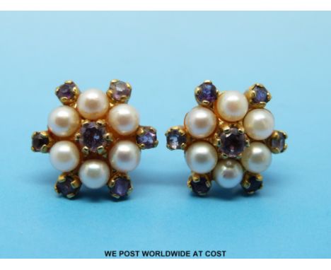 A pair of 9ct gold earrings set with pearls and amethyst in a cluster 