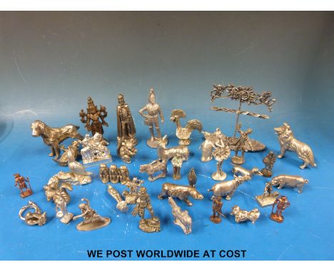 A collectors' cabinet full of novelty animals and figures including a cockerel, Indian goddess, mother-of-pearl penknife etc