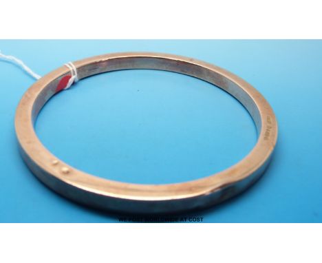 A 9ct rose gold Chester hallmarked flapper bangle (144g) 