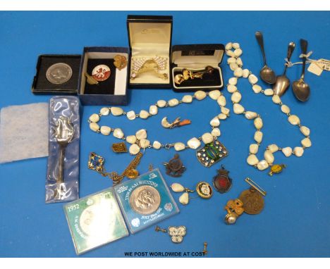 Two mother of pearl beaded necklaces with matching earrings, coral and mother of pearl charm, badges including speedway and f