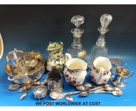 A hallmarked silver dressing table trinket box, diameter 6cm, plated cutlery, cup holders etc, two decanters and three variou