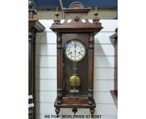 A pine-cased Vienna style wall clock