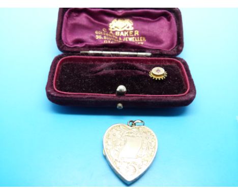 A 9ct gold stick pin set with a ruby in original box and a gold heart shaped locket 