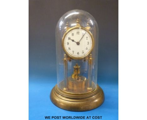 A German anniversary clock with flat disc balance, under a glass dome and engraved to base regarding one F S B Rooks joining 