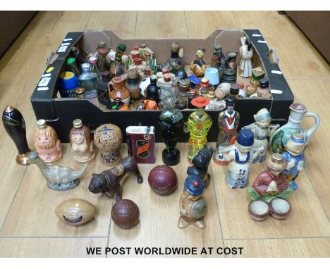 A collection of approximately 40 novelty alcohol miniatures to include Dutch girls, Scotch Whisky golf balls, a Beswick dinos