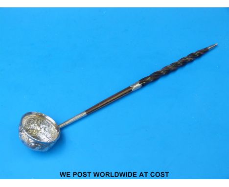 A white metal whale bone-handled toddy ladle (35cm long)