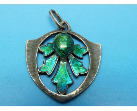 A silver pendant with hammered finish set with greenish blue enamel and marked L & Co for Liberty