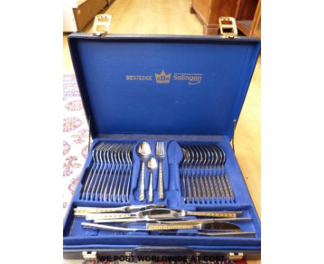 A cased stainless steel cutlery set by Bestecke Solingen together with a silver plate boxed fish knife and fork set 