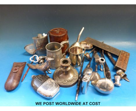 A set of five graduated plated beakers in a leather case, a hallmarked silver funnel, two silver ladles with twisted horn han