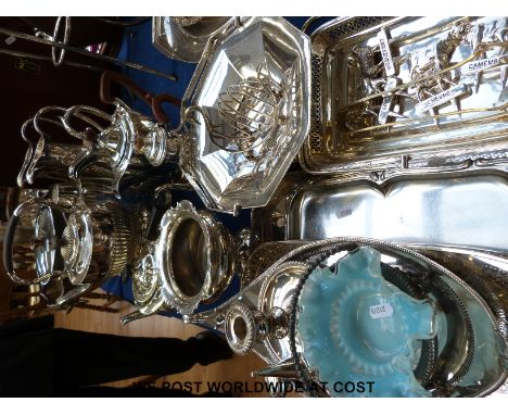 A large collection of silver plate items etc, to include gadrooned kettle on stand, tea pot, coffee pot, two ewers, candle st