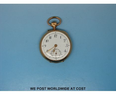 A yellow metal cased keyless fob watch with white enamel dial