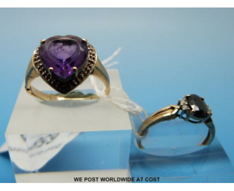 Two 9ct gold rings, one set with a heart shaped amethyst surrounded by diamonds (size O) and the other set with a sapphire an