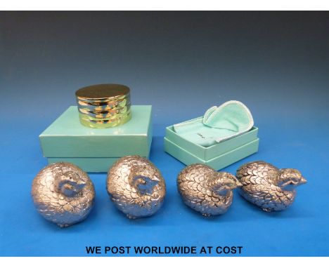 Tiffany & Co desk clock in box together with another Tiffany box and four Gucci bird peppers. 