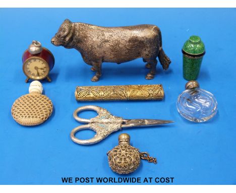 A quantity of novelty collectables to include gilt filigree needle case, hallmarked silver scent bottle, clock tape measure, 