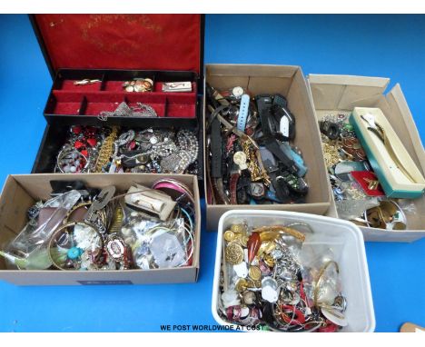 A large collection of costume jewellery including brooches, earrings, watches, white metal items, bangles and a silver item i