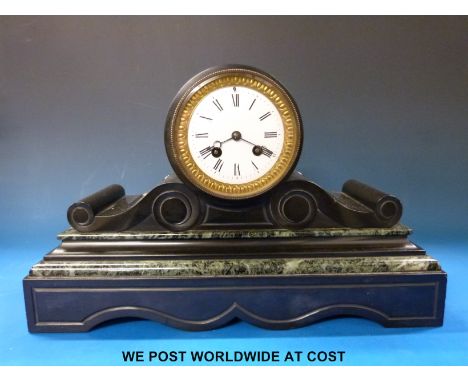 A black slate drum cased mantel clock with two train movement and Roman numerals