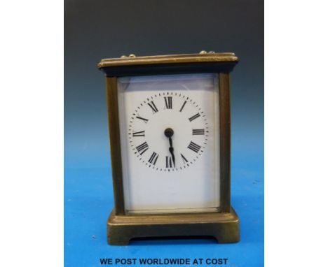 A brass cased carriage clock with white enamel dial together with a quantity of assorted clock and watch keys