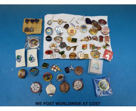 A collection of novelty enamel badges including brewery related, Guinness etc