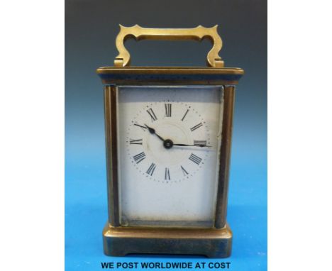 A French carriage clock with Roman numerals, in carry case