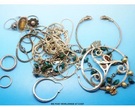 Nine silver/white metal necklaces, a pair of amber and silver earrings, four silver rings, a white metal bangle with rams hea