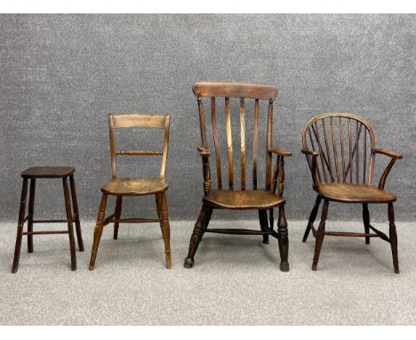 A collection of three chairs and a stool to include a late 19th century elm stick back elbow chair having a hooped back with 