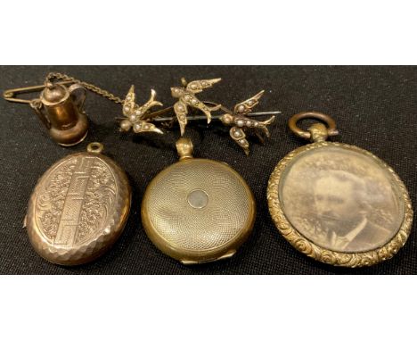 An Edwardian 9ct gold brooch as three swallows in flight, each set with seed pearls, 4cm long; a miniature 9ct gold coffee po