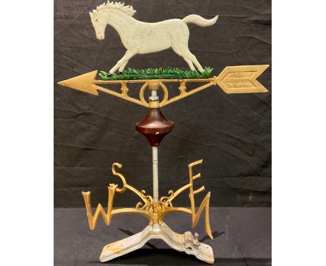 A cast metal weather vane, surmounted with a white horse, metal bracket, 58cm overall 