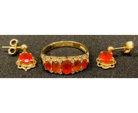 An 18ct gold graduated five stone Mexican fire opal ring, size O, 4.7g; a pair of 9ct gold earrings en suite, 1.6g 