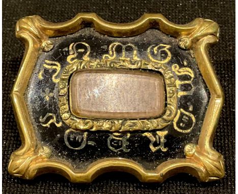 A Victorian shaped rectangular mourning brooch, centre with rounded rectangular hair panel against a black enamel ground, 3cm
