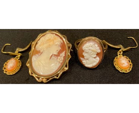 A 9ct gold mounted shell cameo suite, comprising oval pendant/brooch, 7.7g gross and a ring, size P, 3.3g; a pair of unmarked