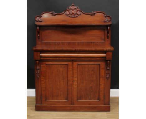 A Victorian mahogany chiffonier, shaped back with serpentine shelf carved and applied with C-scrolls and acanthus, rectangula
